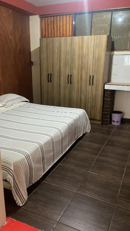 En eller flere senge i et værelse på Residencial Misky Dreams