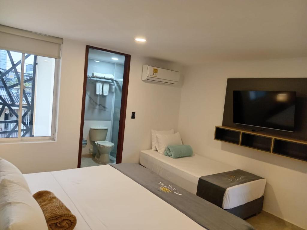 TV a/nebo společenská místnost v ubytování Buendía Hotel