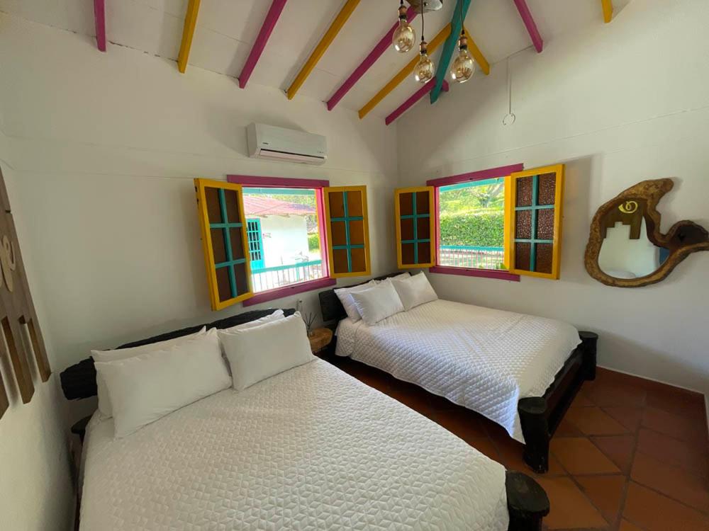 Postel nebo postele na pokoji v ubytování Hotel El Remanso Cartago