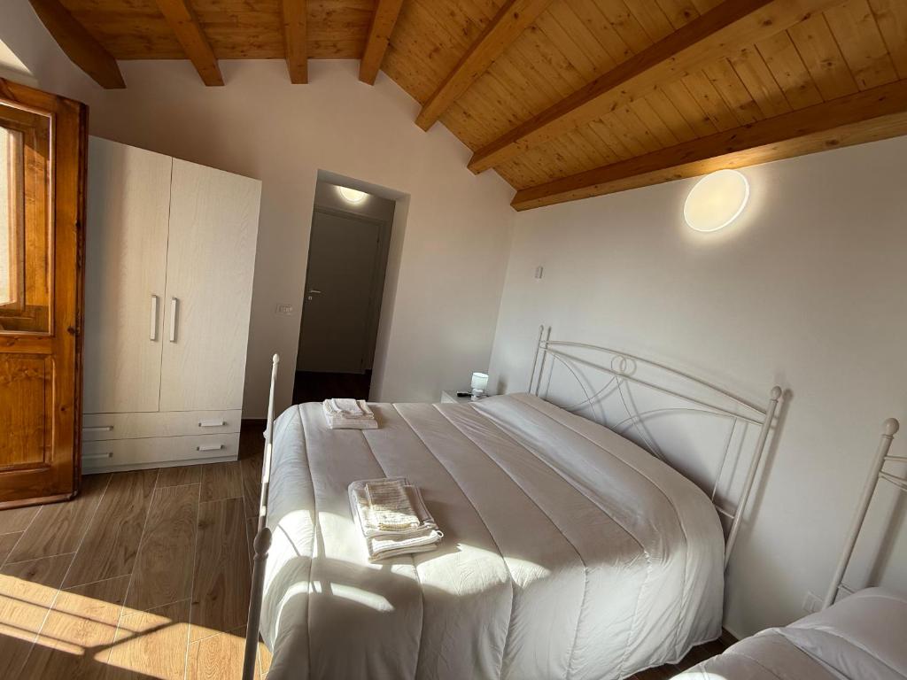 Postel nebo postele na pokoji v ubytování B&B La Ginestra