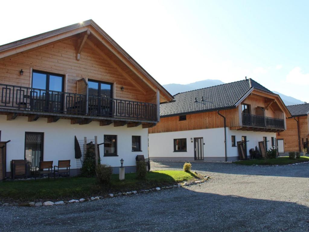 a house with a balcony on the side of it at Rattendorf 3B in Rattendorf