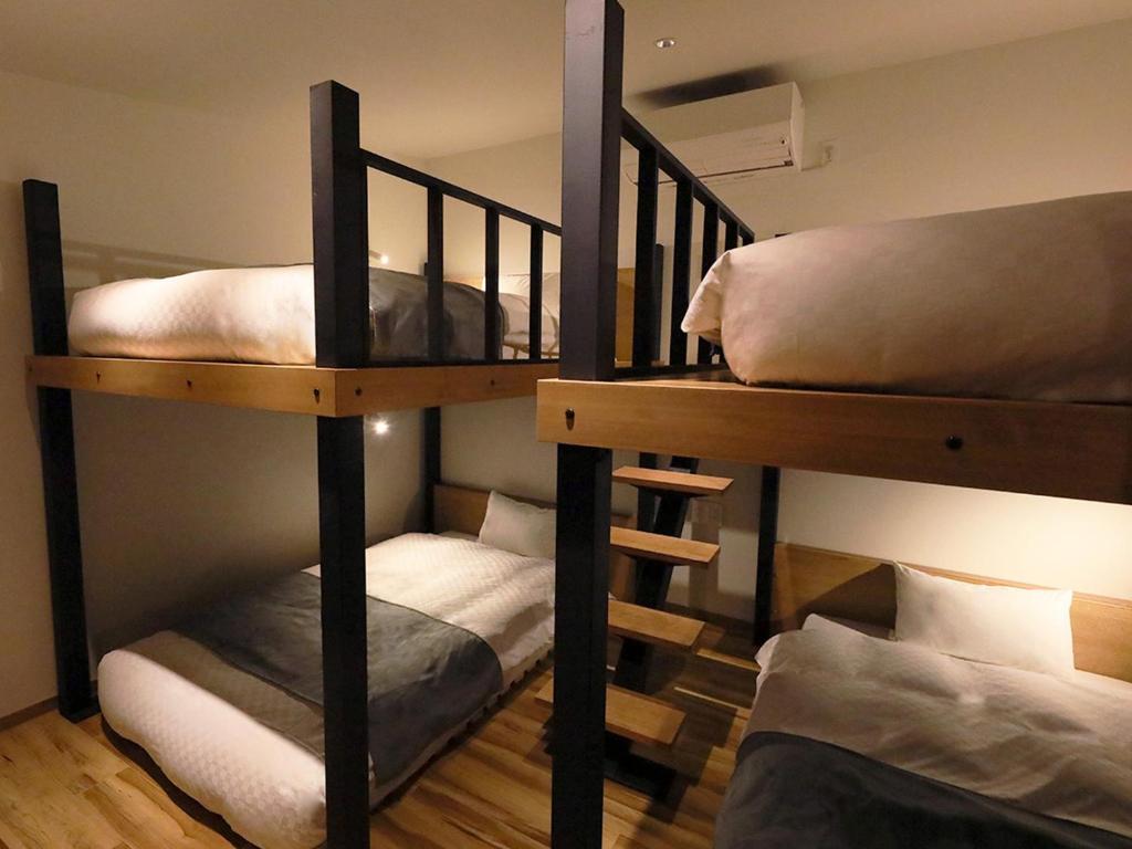 Postel nebo postele na pokoji v ubytování Hakuba Ryujin Onsen RYOKAN SUI