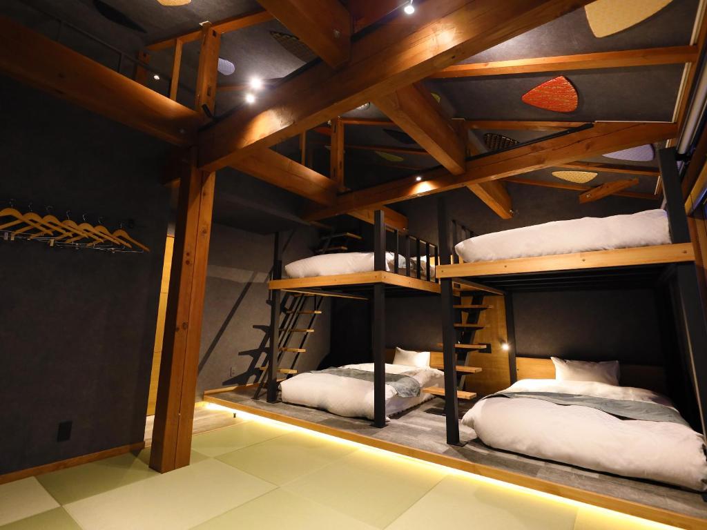 Postel nebo postele na pokoji v ubytování Hakuba Ryujin Onsen RYOKAN SUI