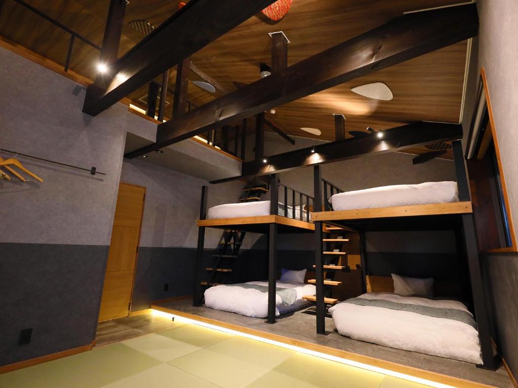 Postel nebo postele na pokoji v ubytování Hakuba Ryujin Onsen RYOKAN SUI