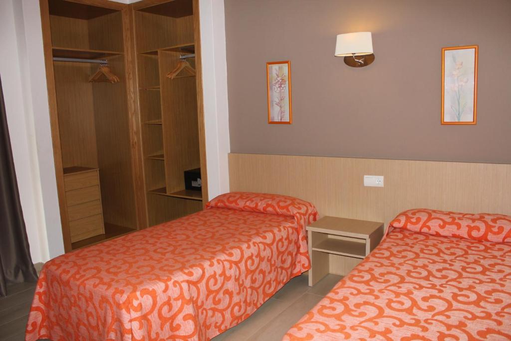 Postel nebo postele na pokoji v ubytování Apartamentos Orvay