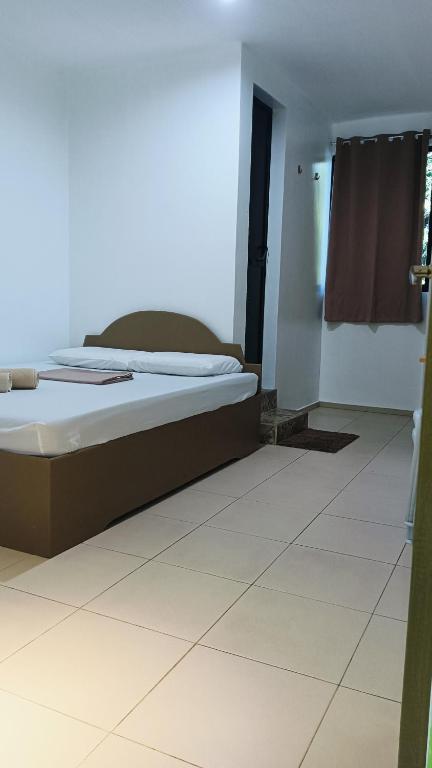Postel nebo postele na pokoji v ubytování Alona Guest House