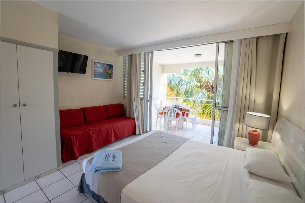 Uma cama ou camas num quarto em Canella Beach Hotel
