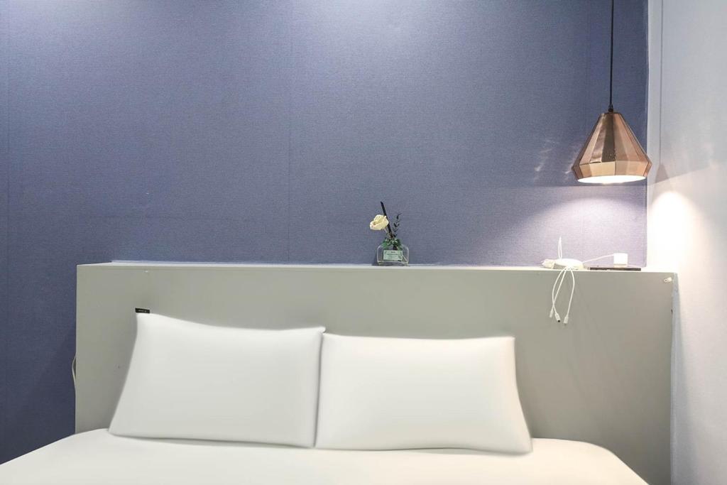 Postel nebo postele na pokoji v ubytování Hotel Stay Q Daejeon