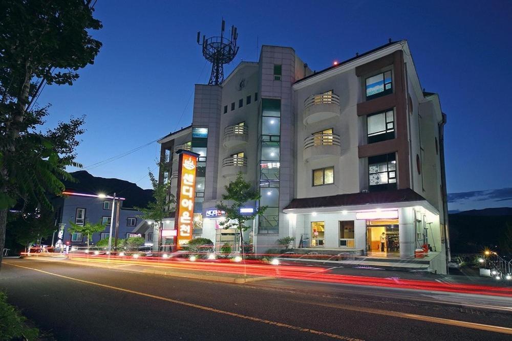 a building on the side of a street at night at Ulsan Yeongnam Alps Sandia Oncheon in Ulsan