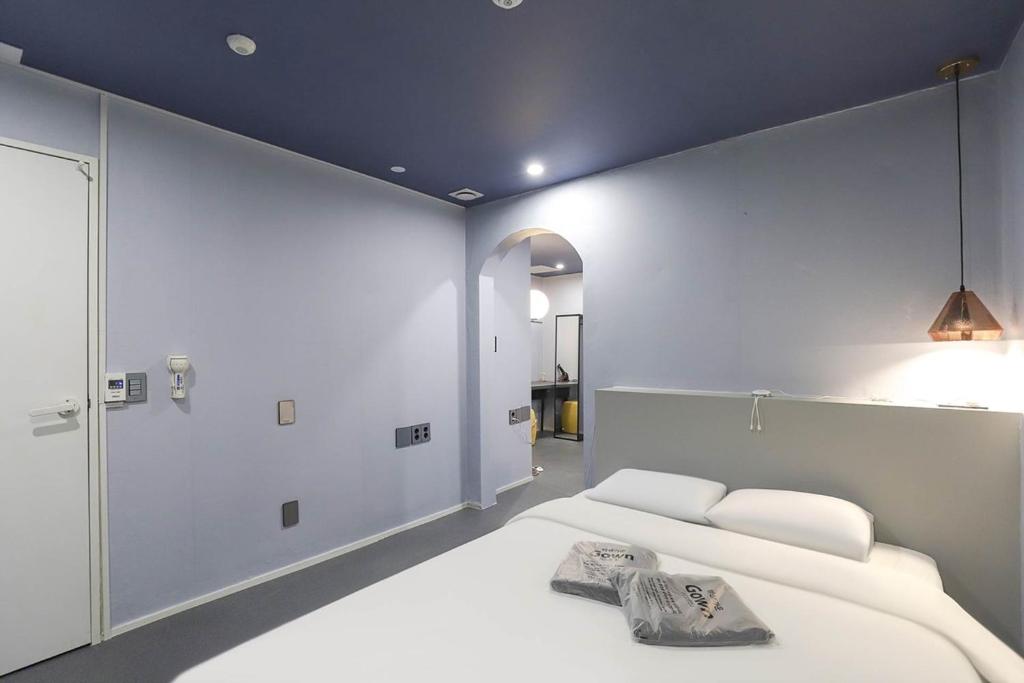 Postel nebo postele na pokoji v ubytování Hotel Stay Q Daejeon