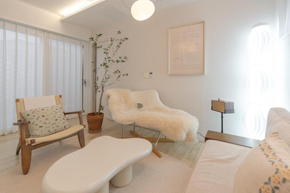 Ένα ή περισσότερα κρεβάτια σε δωμάτιο στο Hug Jeju