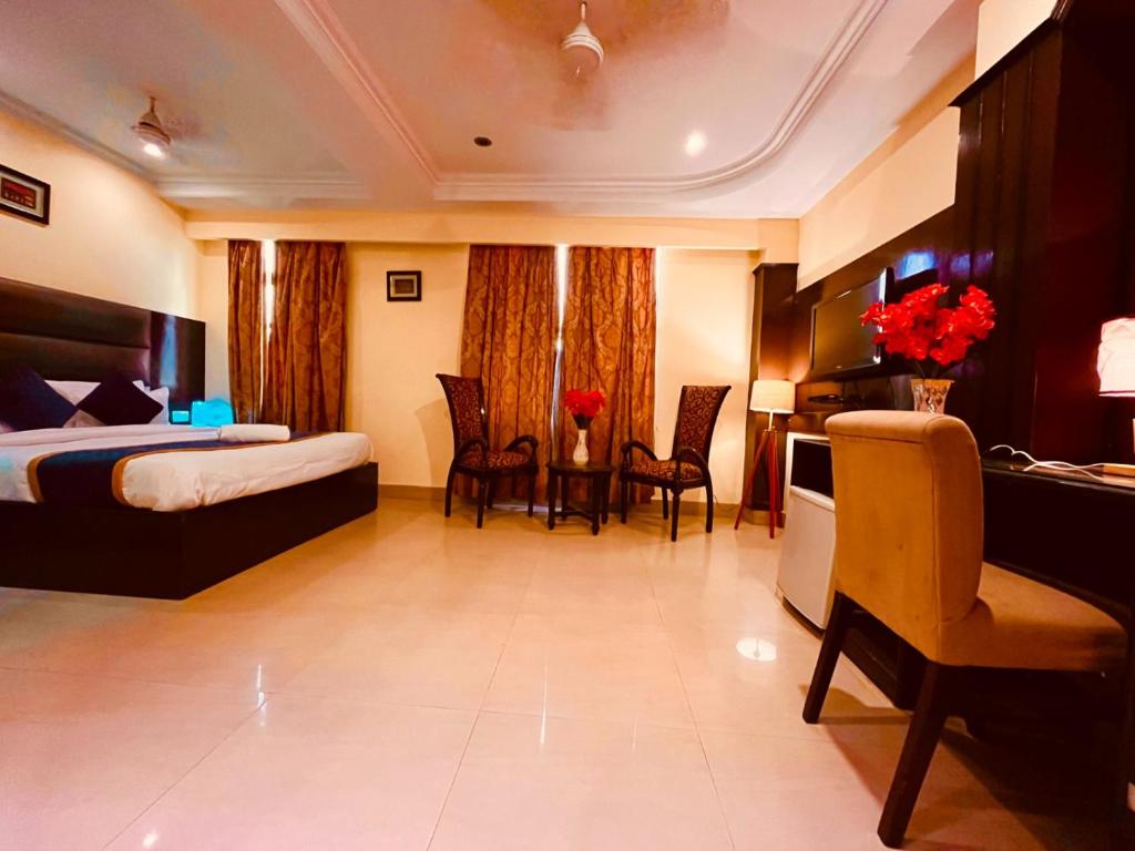 Postel nebo postele na pokoji v ubytování The Reo Lodge, Haridwar