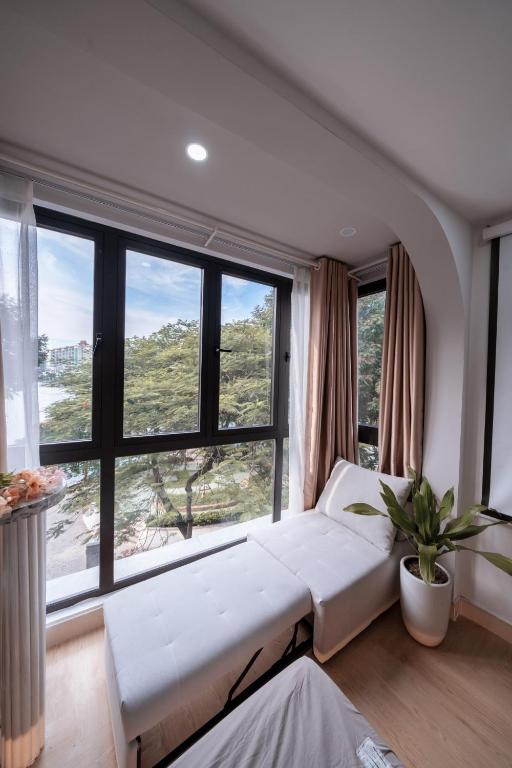Postel nebo postele na pokoji v ubytování Aimee House Homestay Trấn Vũ