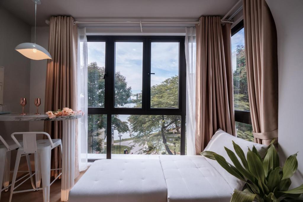 Postel nebo postele na pokoji v ubytování Aimee House Homestay Trấn Vũ