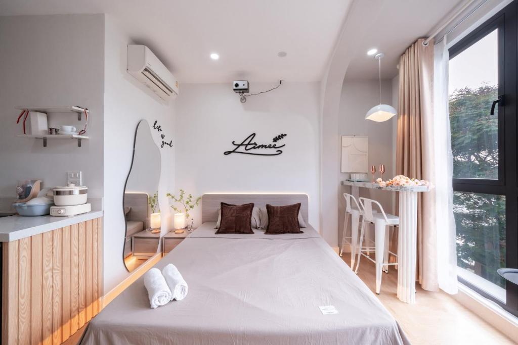 Postel nebo postele na pokoji v ubytování Aimee House Homestay Trấn Vũ