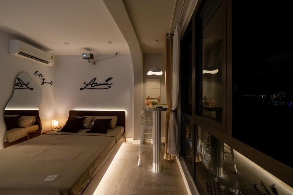 Postel nebo postele na pokoji v ubytování Aimee House Homestay Trấn Vũ