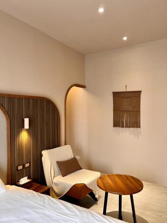 Postel nebo postele na pokoji v ubytování Yuzhi Wenlv B&B
