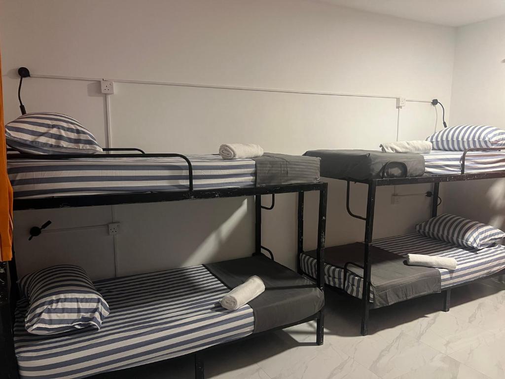 Postel nebo postele na pokoji v ubytování Mounty K backpack Hostels