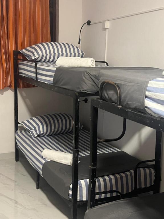 Postel nebo postele na pokoji v ubytování Mounty K backpack Hostels