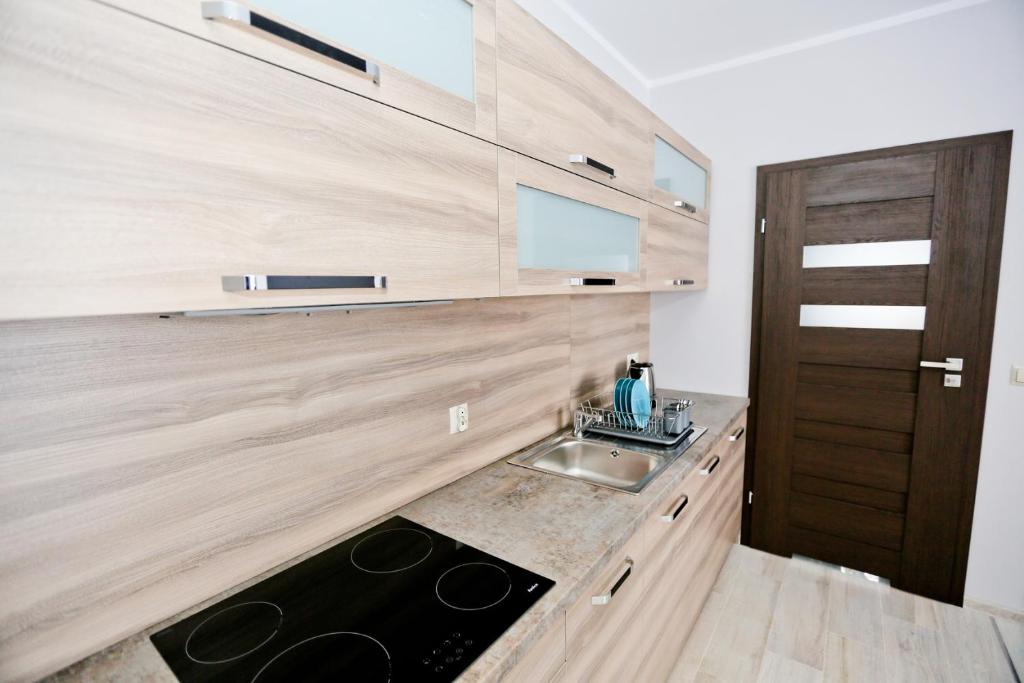 Kuchyňa alebo kuchynka v ubytovaní Apartamenty Pod Skrzycznem