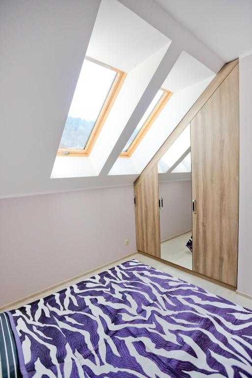 Posteľ alebo postele v izbe v ubytovaní Apartamenty Pod Skrzycznem