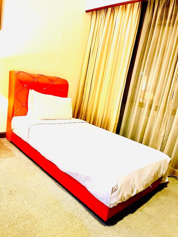 Postel nebo postele na pokoji v ubytování RESORT SUITES AT BARJAYA TIMES SQUARE kL