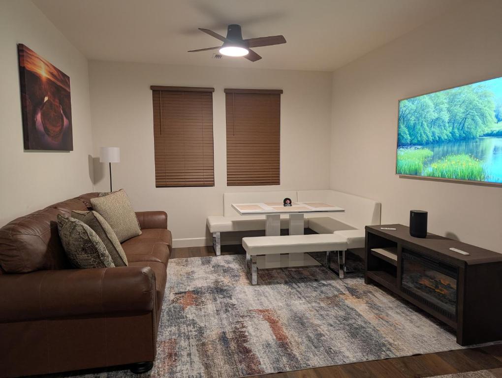 a living room with a couch and a table at Mountain Melody Hideaway in Reno