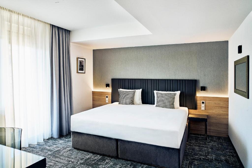 Letto o letti in una camera di Hotel International Brno