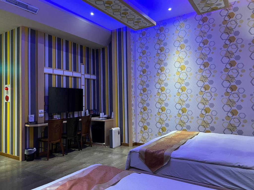 TV a/nebo společenská místnost v ubytování Wei Feng Exquisite Motel Pintung Branch