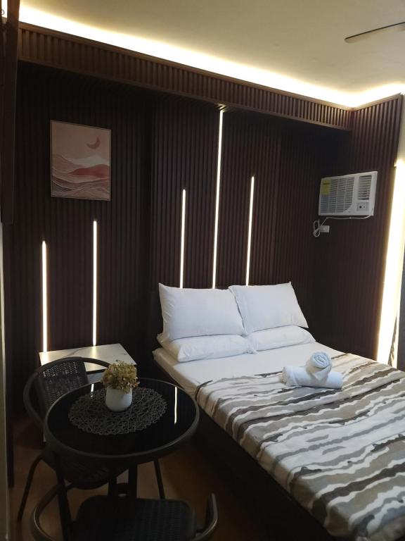 Ένα ή περισσότερα κρεβάτια σε δωμάτιο στο Trendy Studio Near Cebu IT Park