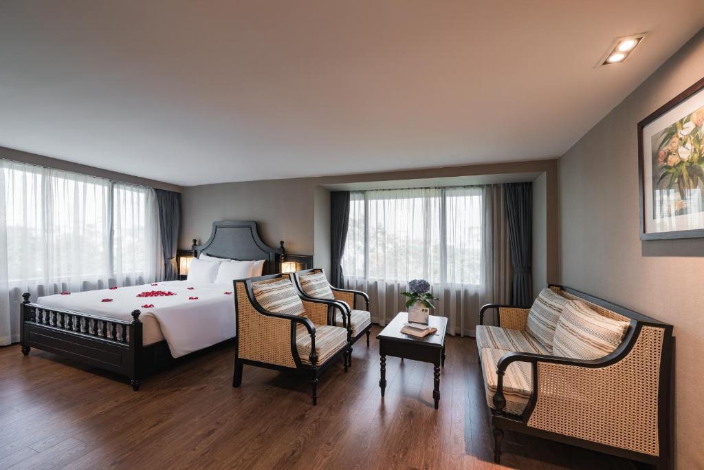 Postel nebo postele na pokoji v ubytování La Passion Classic Hotel