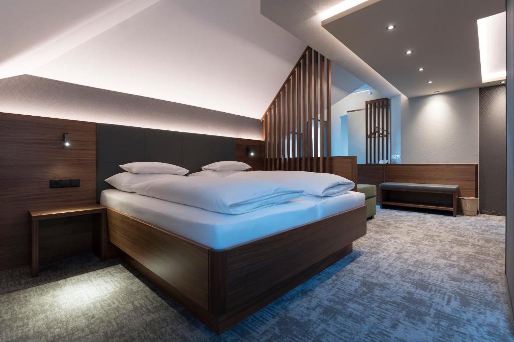 Postel nebo postele na pokoji v ubytování Hotel Garni Astoria