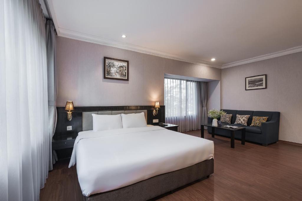 Postel nebo postele na pokoji v ubytování La Passion Classic Hotel