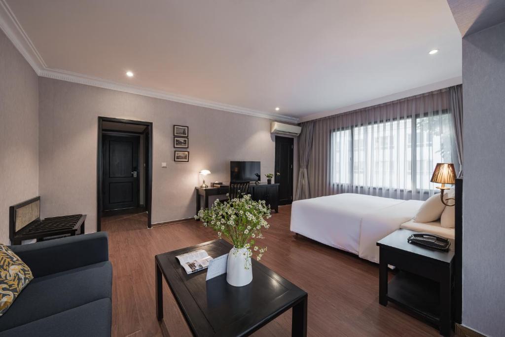 Postel nebo postele na pokoji v ubytování La Passion Classic Hotel