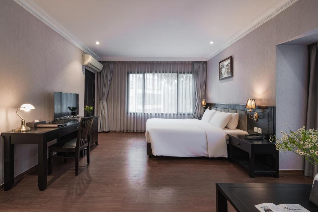 Postel nebo postele na pokoji v ubytování La Passion Classic Hotel