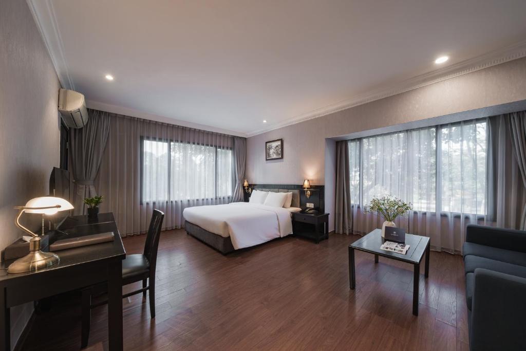 Postel nebo postele na pokoji v ubytování La Passion Classic Hotel