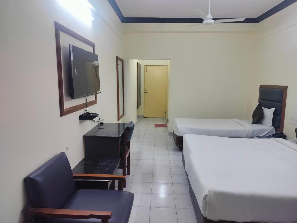 Voodi või voodid majutusasutuse Hotel Ranjit Residency toas