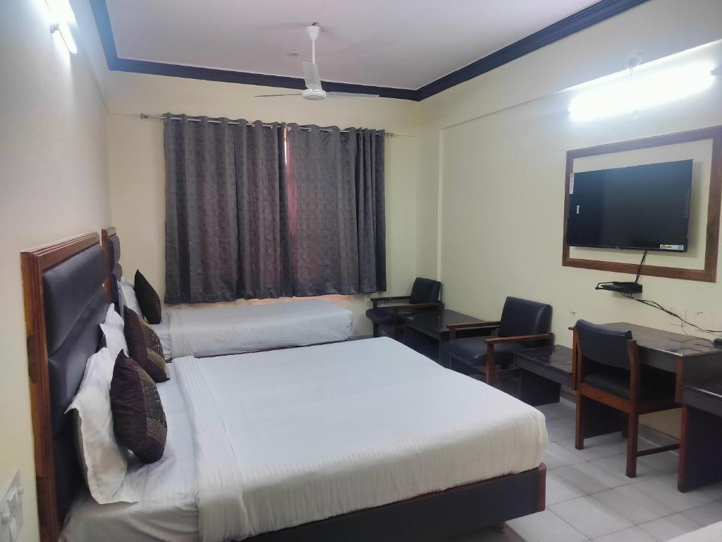 Voodi või voodid majutusasutuse Hotel Ranjit Residency toas