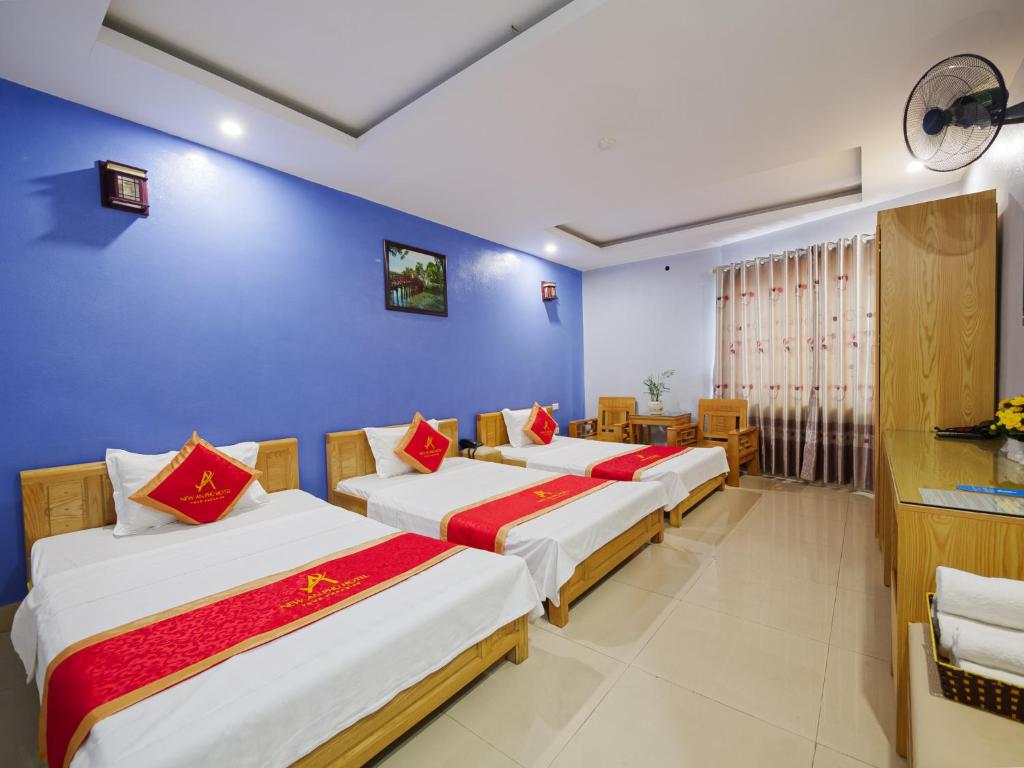 Postel nebo postele na pokoji v ubytování New An Phú Hotel
