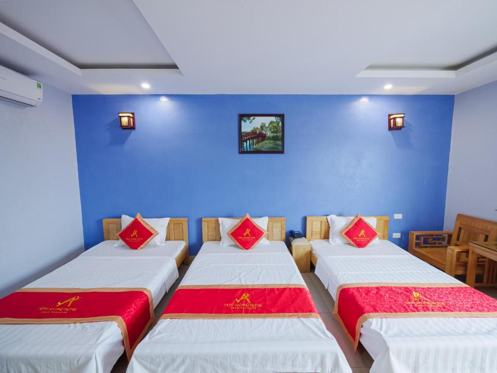 Postel nebo postele na pokoji v ubytování New An Phú Hotel