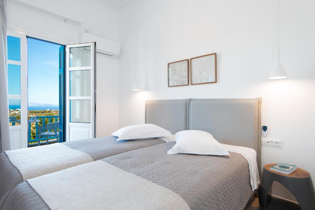 Postel nebo postele na pokoji v ubytování Anthousa Hotel