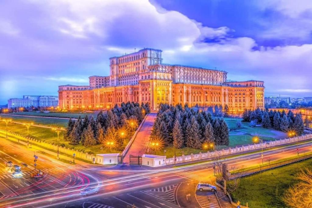 a large building with a street in front of it at House of Parliament Ultracentral Apartament self check in in Bucharest