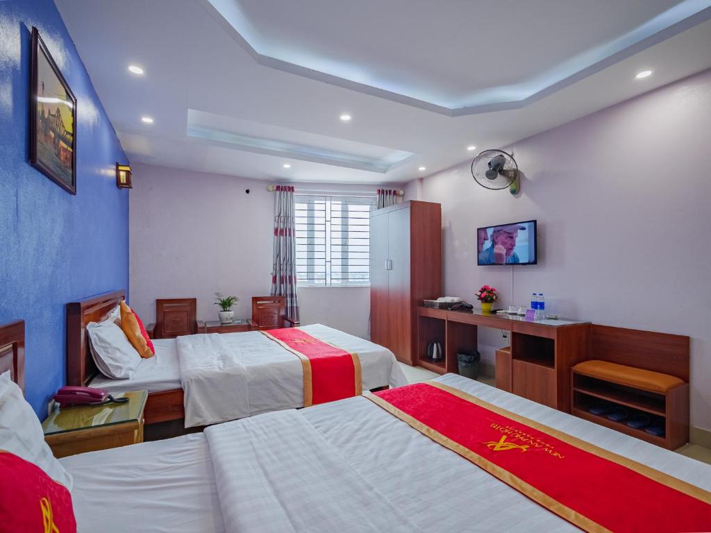 Postel nebo postele na pokoji v ubytování New An Phú Hotel