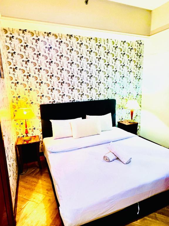 Postel nebo postele na pokoji v ubytování RESORT SUITES AT BARJAYA TIMES SQUARE kL