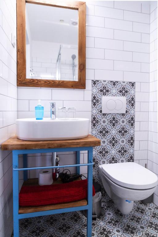 a bathroom with a sink and a toilet at Mathias Rex in Szentendre