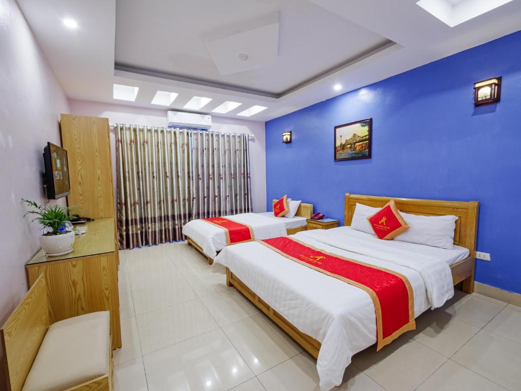 Postel nebo postele na pokoji v ubytování New An Phú Hotel