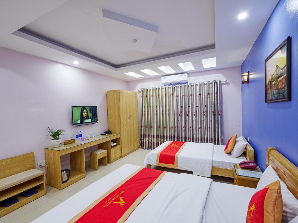 Postel nebo postele na pokoji v ubytování New An Phú Hotel