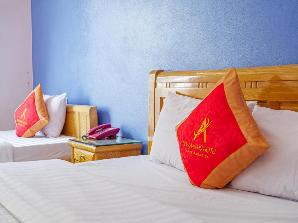 Postel nebo postele na pokoji v ubytování New An Phú Hotel