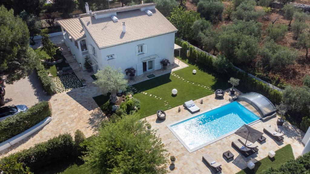 an aerial view of a house with a swimming pool at VILLA RUDY 8, Emma Villas in Padresergio
