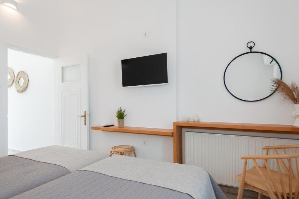 Postel nebo postele na pokoji v ubytování Anthousa Hotel